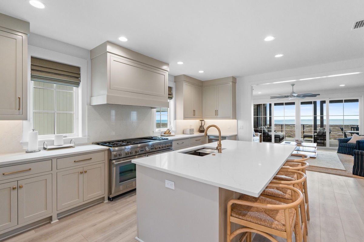 Your chef-worthy kitchen features premium appliances and a spacious island where you can gather while preparing memorable meals together.