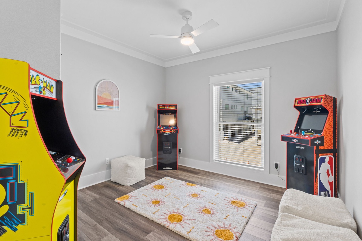 This game room invites you to step back into classic arcade fun with vintage-style cabinets and cozy seating for ultimate relaxation.