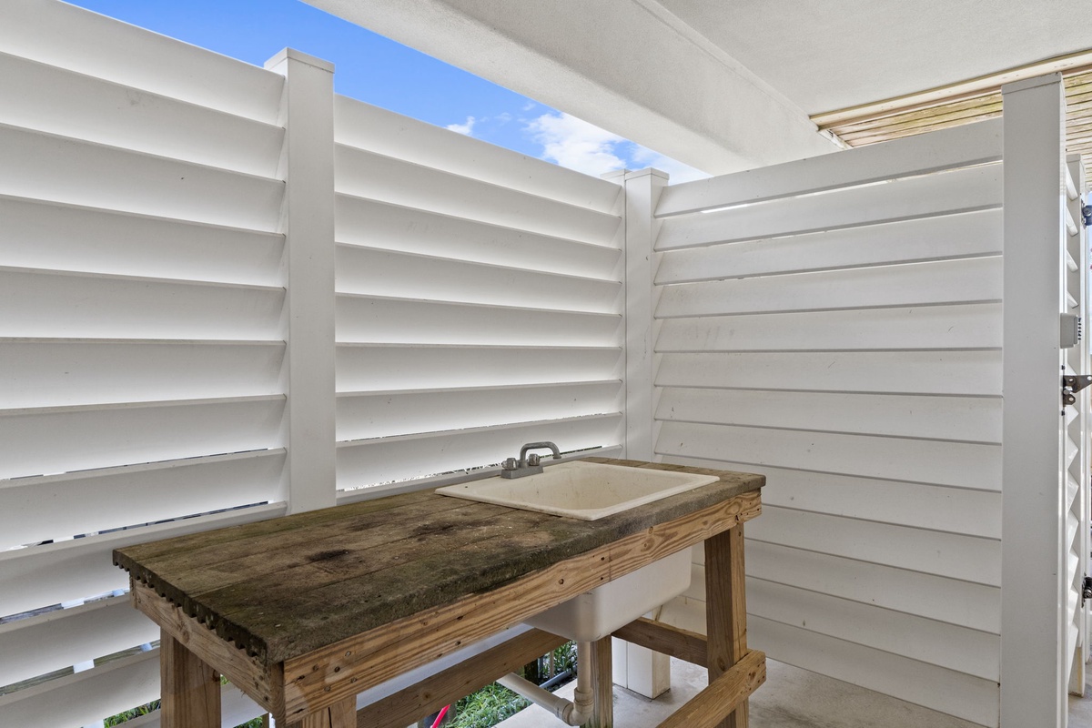 A private outdoor prep station offers a secluded space to clean your catch under open sky, surrounded by bright privacy panels that ensure your convenience and peace.