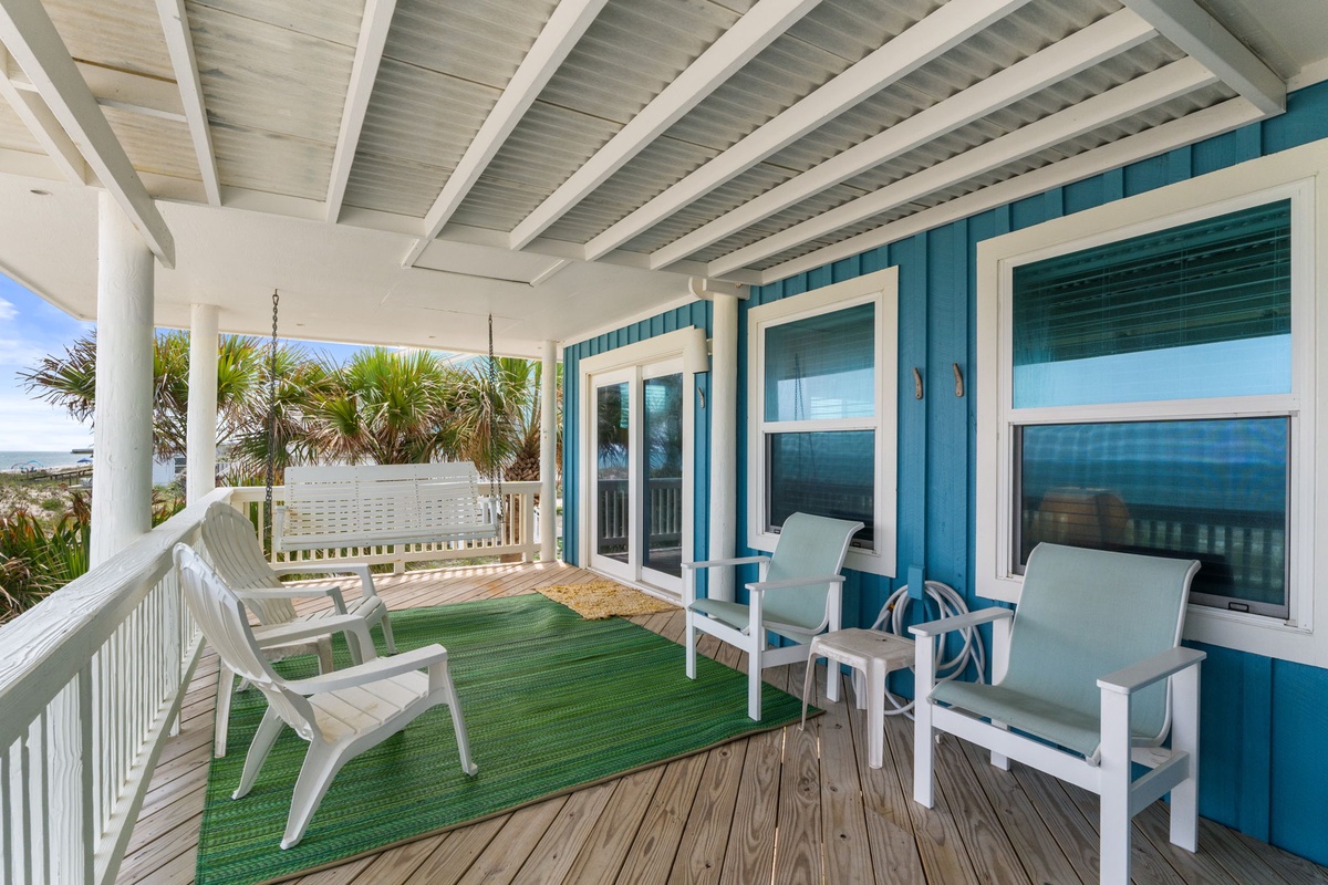 Settle into your private balcony and let the ocean breeze wash over you. With plush seating, coastal views, and swaying palms just beyond the rail, this is where your mornings start and evenings unwind.