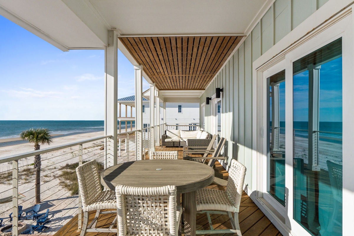Your private oceanfront terrace offers stunning Gulf views and comfortable outdoor dining steps from the sand.