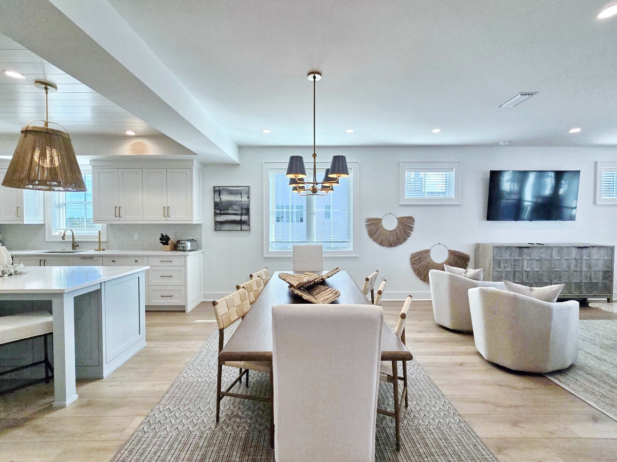 Unwind in this bright, open living space where modern coastal elegance meets comfort, perfect for gathering with loved ones.