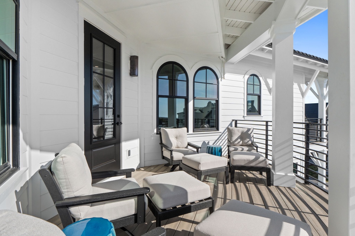 Unwind on your private balcony with plush seating and stunning arched windows that frame perfect views.