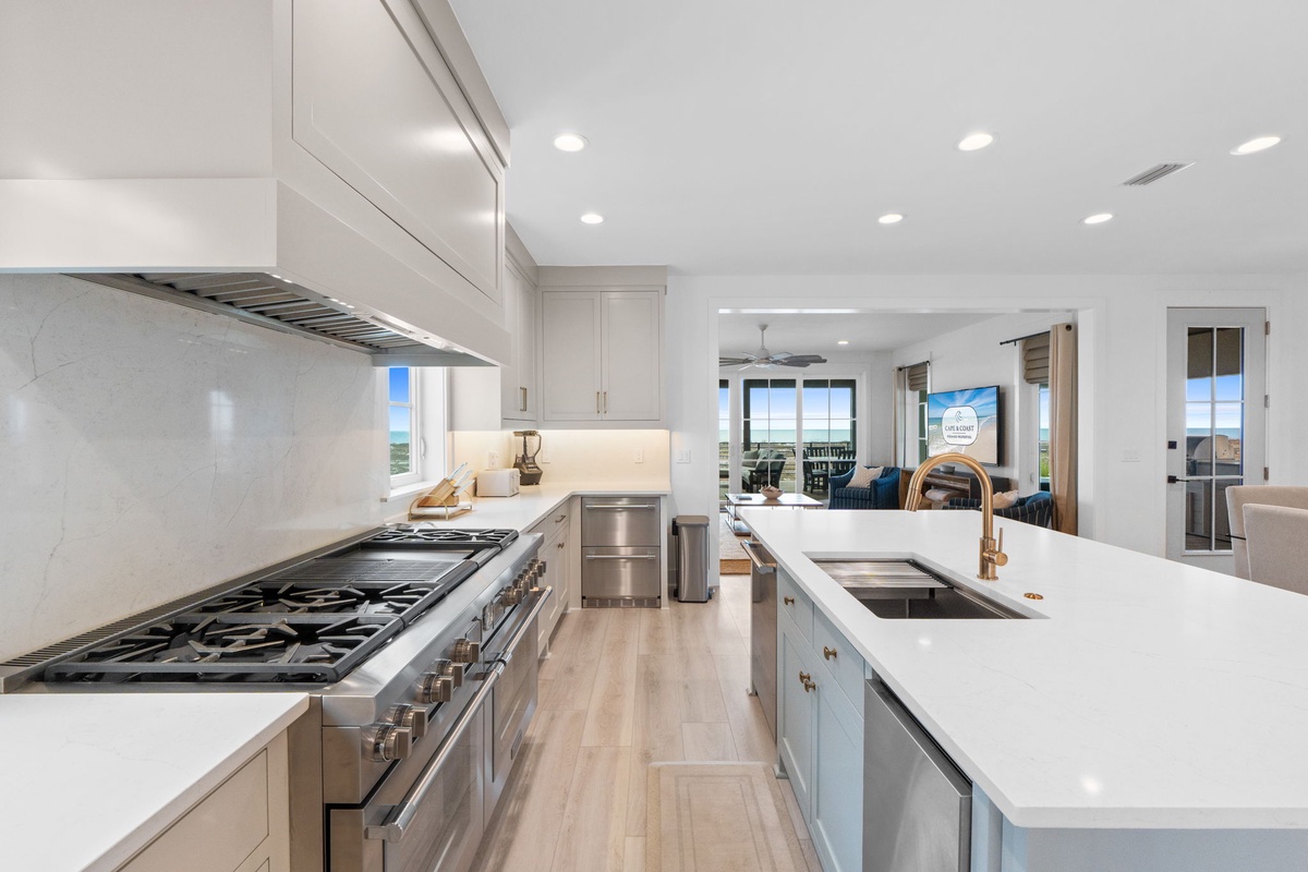 Your gourmet kitchen features premium appliances, marble countertops, and an elegant island perfect for cooking memorable meals during your stay.