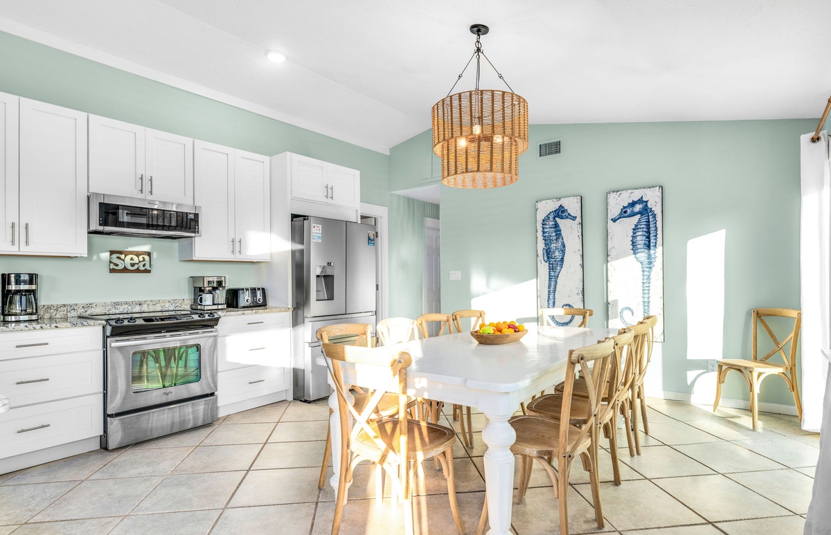 Your bright coastal kitchen welcomes you with sea-themed touches, natural textures, and everything needed for memorable meals together.