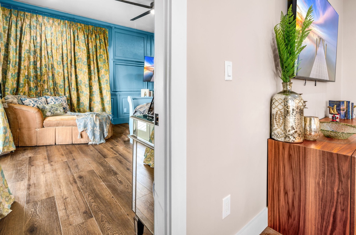 Step into your stylishly appointed retreat where warm wood tones and coastal blues create the perfect atmosphere for relaxation and comfort.