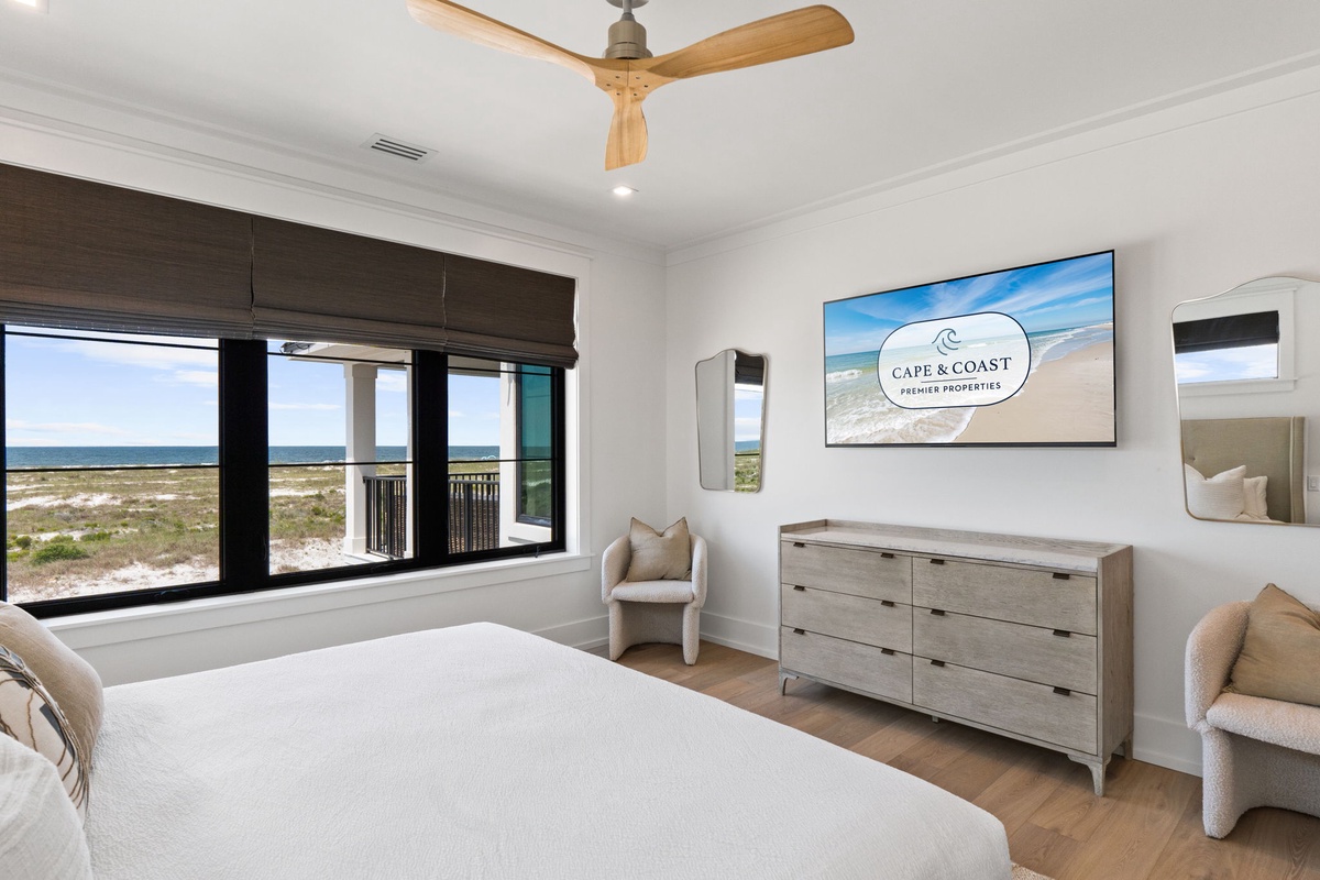 Wake up to stunning ocean views from your cozy bedroom, where soft linens and coastal breezes promise restful nights and serene mornings by the sea.