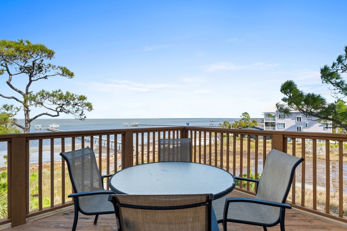 Savor morning coffee at your private table while gazing at sparkling waters and coastal charm stretching to the horizon.