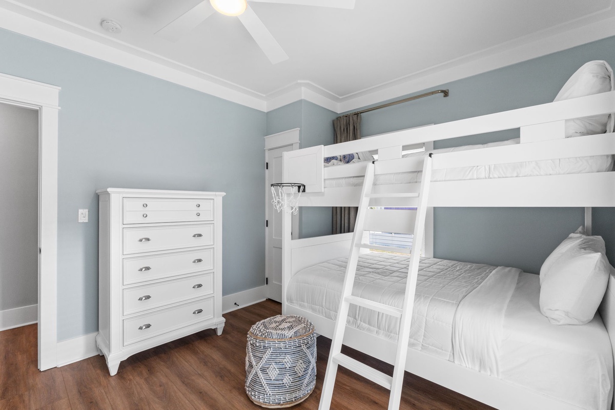 Your kids will love this charming bunk room with crisp white linens and coastal blue walls. Plenty of storage keeps your family organized during your stay.