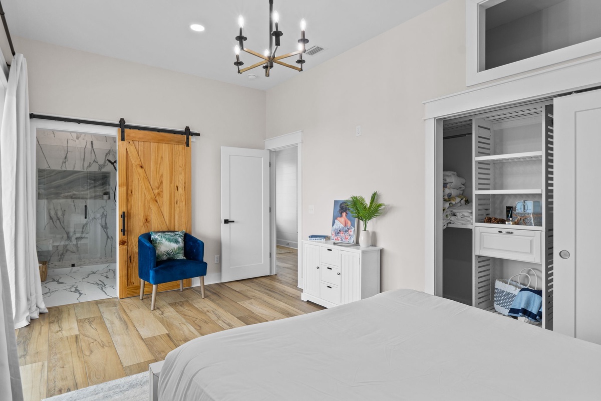 You'll love the spacious layout with charming barn door details, a cozy seating nook, and en-suite marble shower. Natural light fills your private retreat with warmth and comfort.