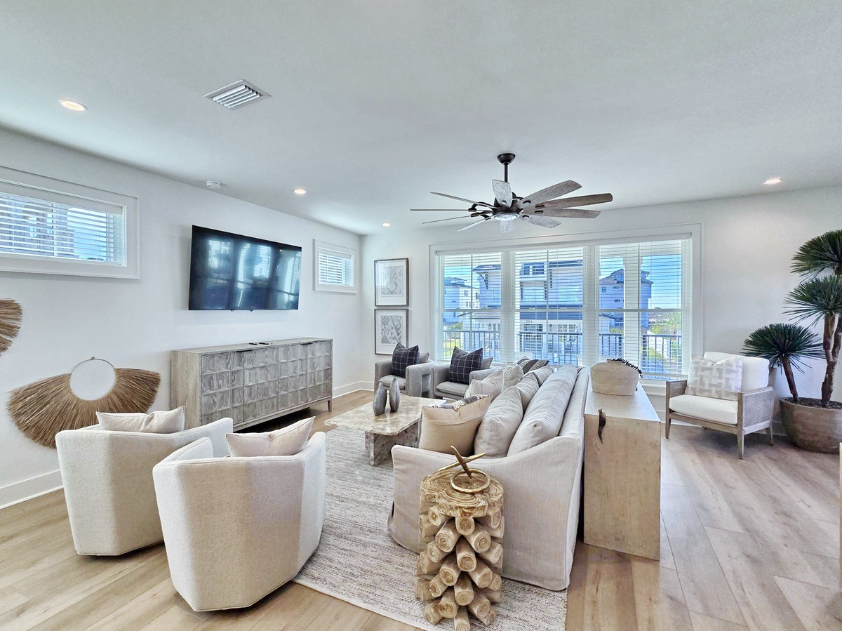 Sink into plush seating while watching your favorite shows on the mounted TV in this elegantly designed living space.