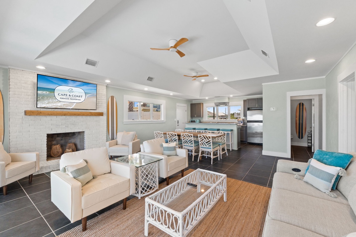 This bright, open living space invites you to unwind in coastal comfort, with soft seating, an airy kitchen, and thoughtful design that makes your getaway feel effortless and welcoming.
