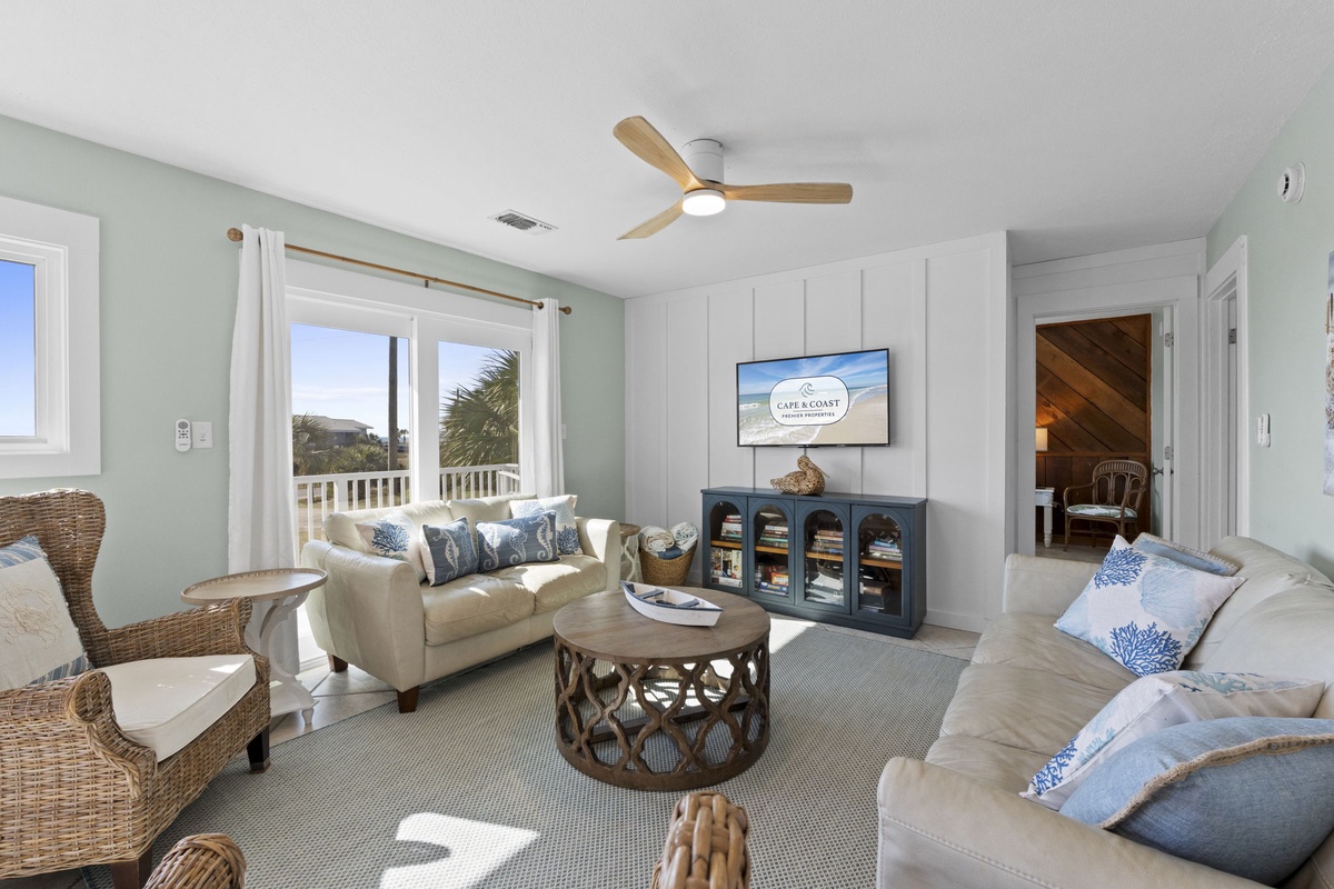 Natural light fills the living space, with direct access to the deck just steps away.