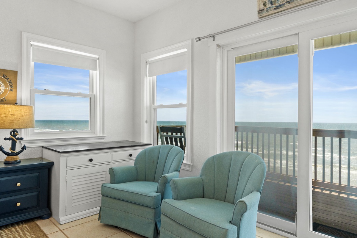 Sink into plush seating as ocean breezes drift through your windows and doors, offering breathtaking sea views that make every moment feel like a coastal dream.