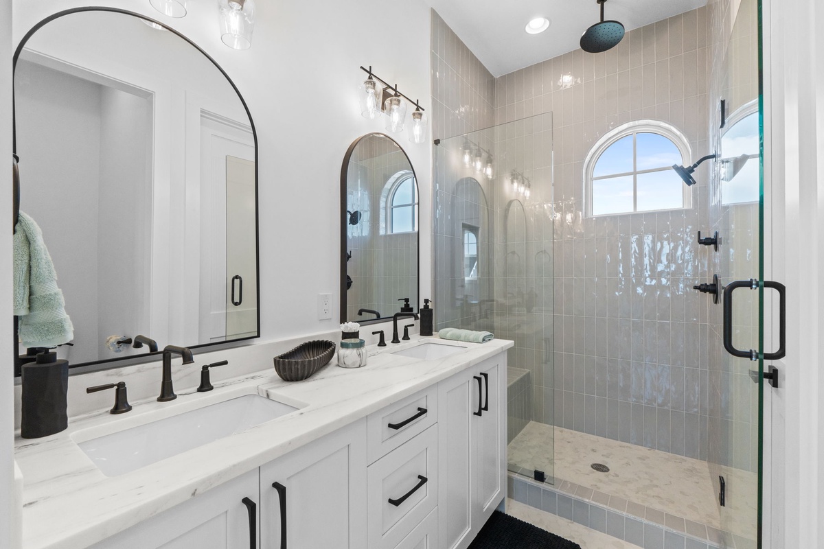 Refresh in your beautifully appointed bathroom with dual vanities, rainfall shower, and elegant marble finishes that create a spa-like retreat.