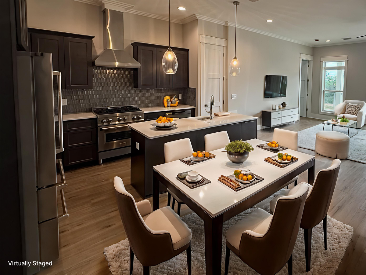Your gourmet kitchen flows seamlessly into the dining area, where modern appliances and elegant pendant lighting create the perfect space for memorable meals.