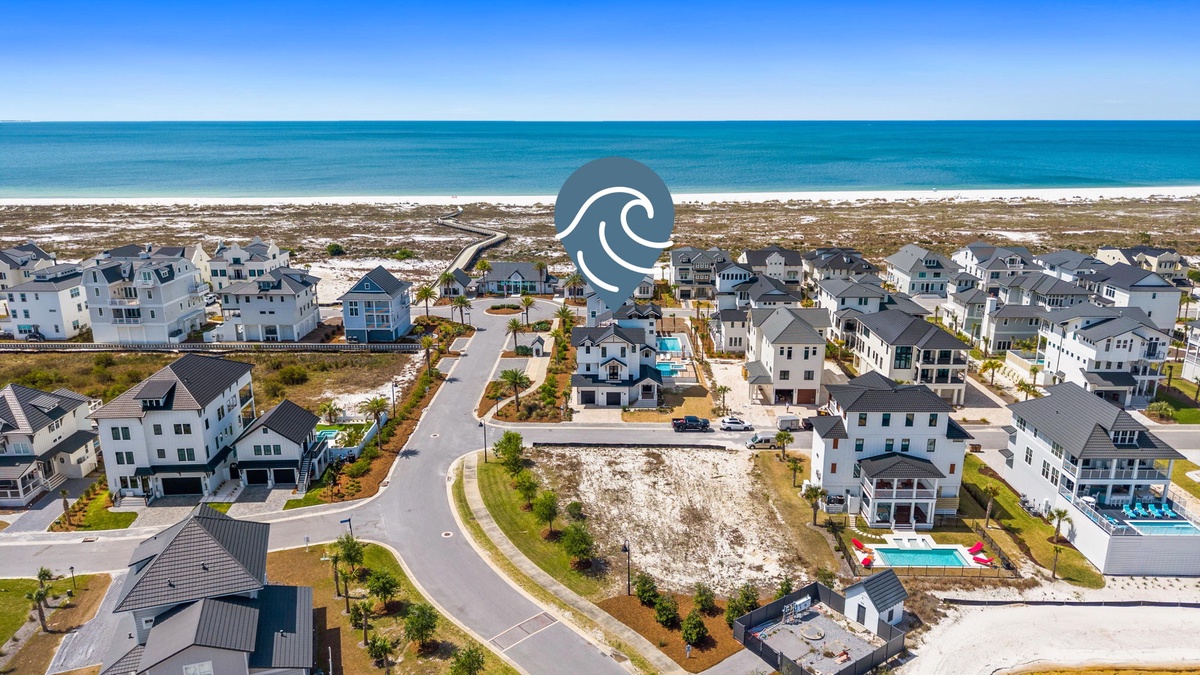 Stunning beachfront community with luxury vacation homes positioned steps from pristine sandy shores and crystal-clear waters.