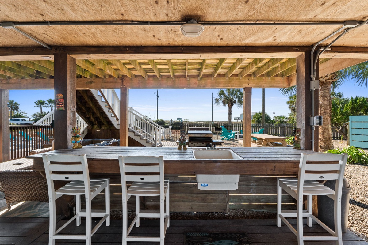 Pull up a seat at the tiki bar and enjoy the open-air setting just steps from the beach.