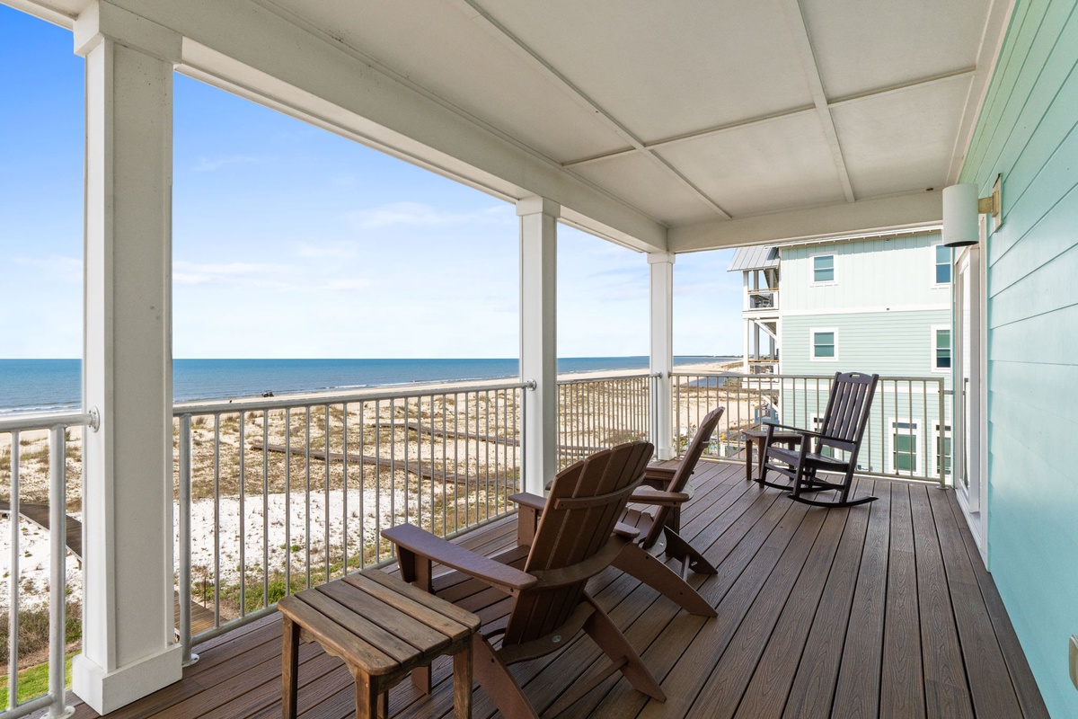 Settle into your favorite chair and soak in the endless ocean views from your private covered deck—just steps from the sandy shore.