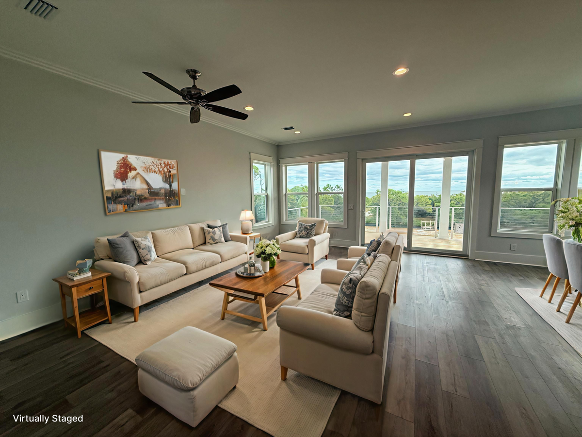 Relax in your bright living space with panoramic windows and comfortable seating that invites you to unwind.