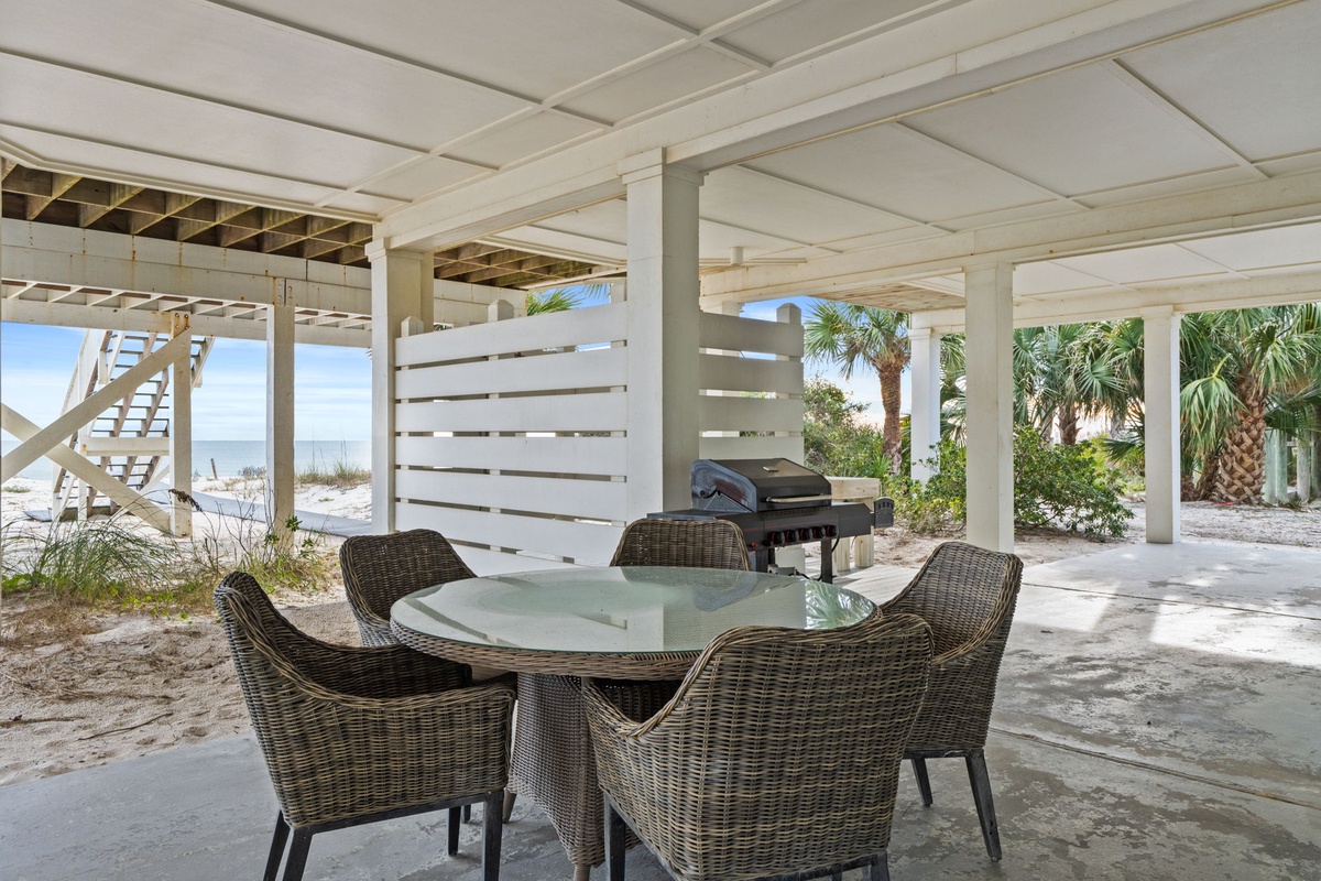 Gather around your private dining table for beachfront meals, with the Gulf waters and swaying palms creating your perfect backdrop.