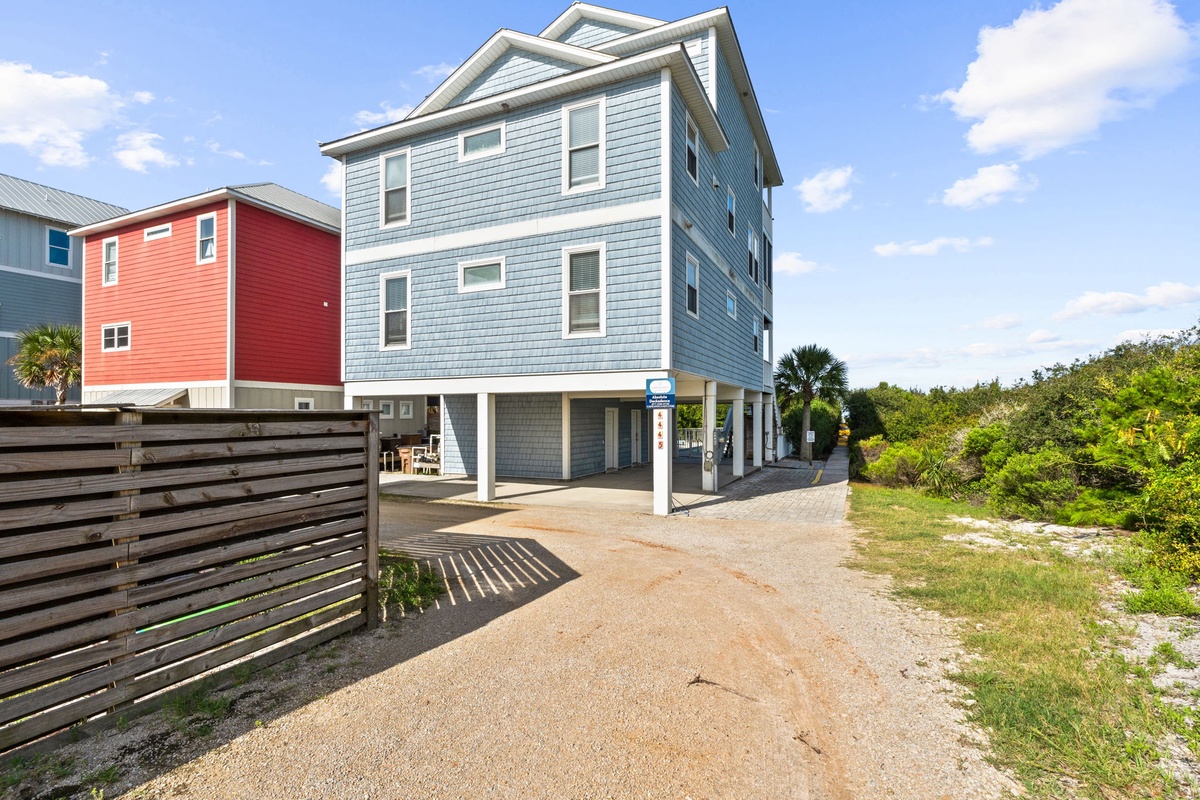 A coastal vacation home with covered parking and native landscaping in a quiet beach neighborhood.