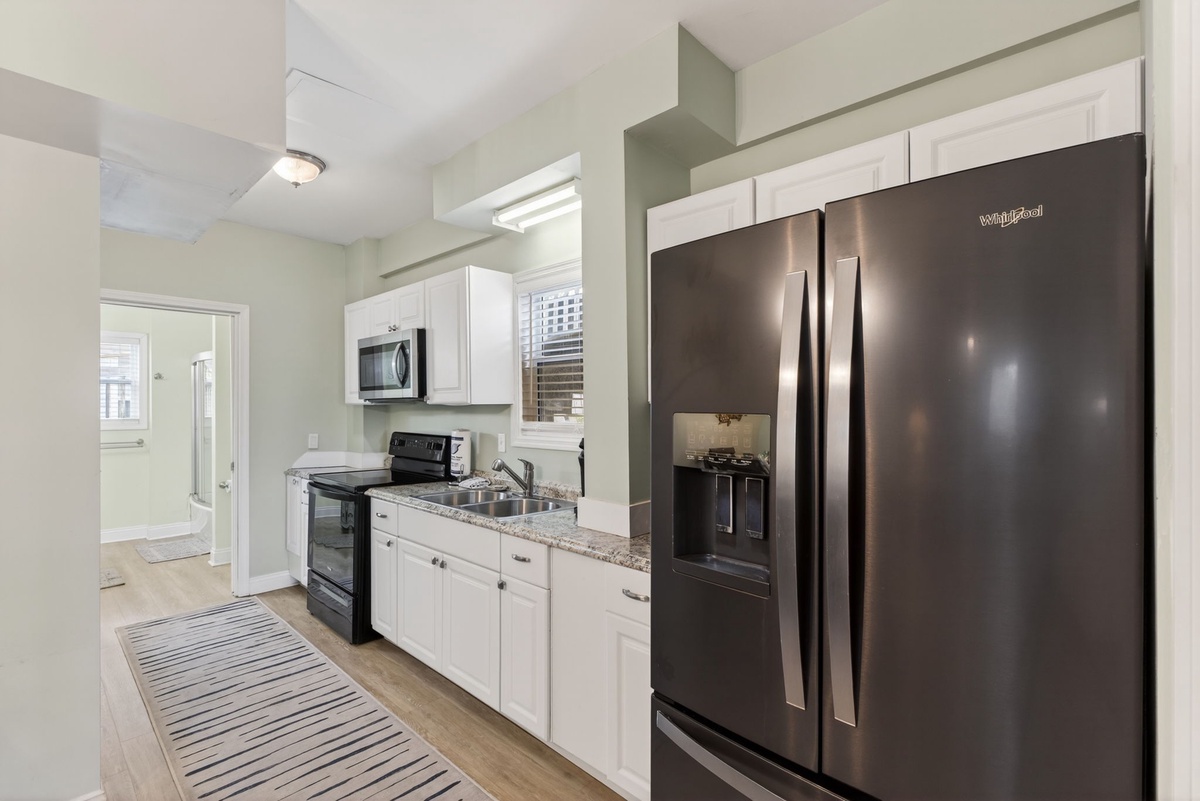 Your fully equipped kitchen awaits with granite counters, stainless steel appliances, and everything you need to create memorable meals.