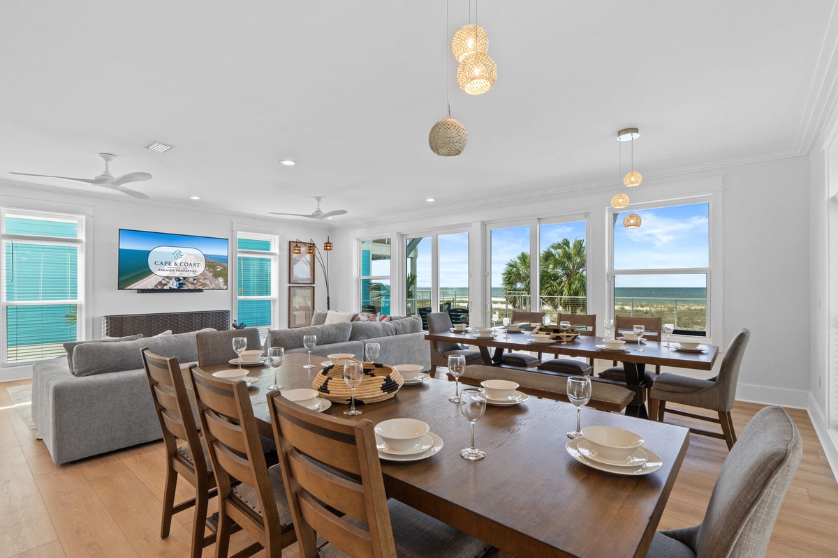 Gather around the spacious dining table where ocean breezes drift through palm-lined windows, and every meal feels like a celebration with sweeping coastal views as your backdrop.