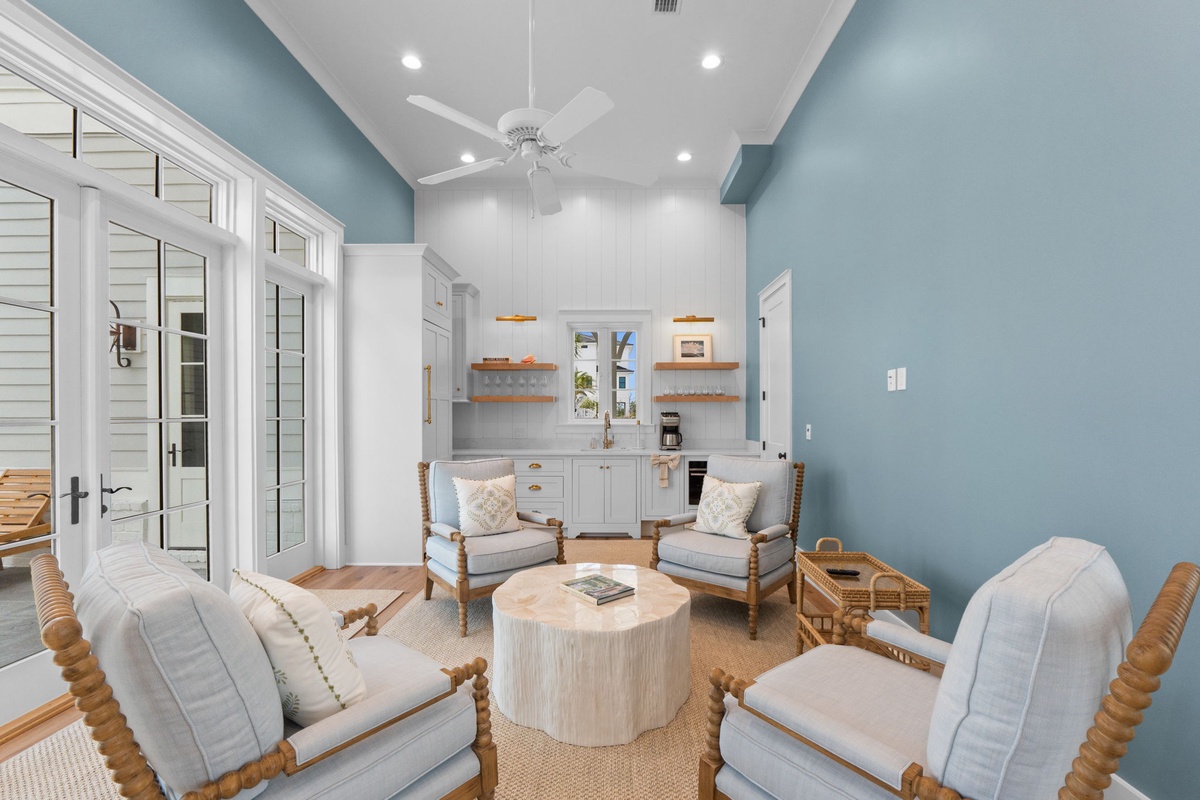 Unwind in your coastal-inspired living room, where soft blues meet natural wood accents. Sink into plush seating, enjoy high ceilings, and let the breezy ambiance calm your mind.