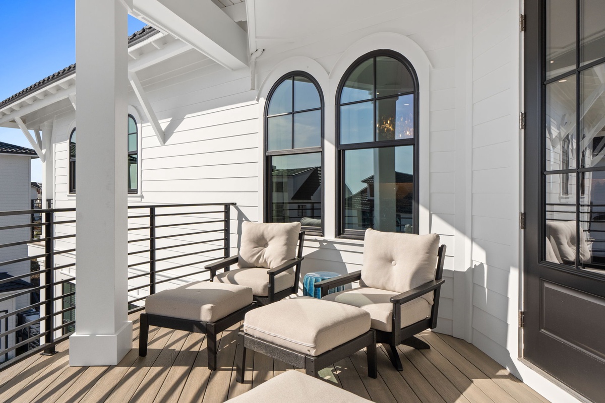 Unwind on your private balcony where plush seating and warm sunshine create the perfect retreat for morning coffee or evening relaxation.