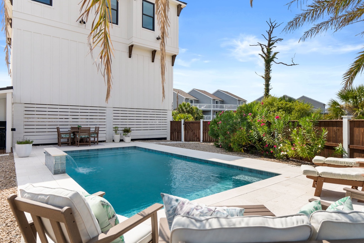 Dive into your private pool oasis, framed by lush tropical palms and sunny skies—perfect for unwinding after a beach day.