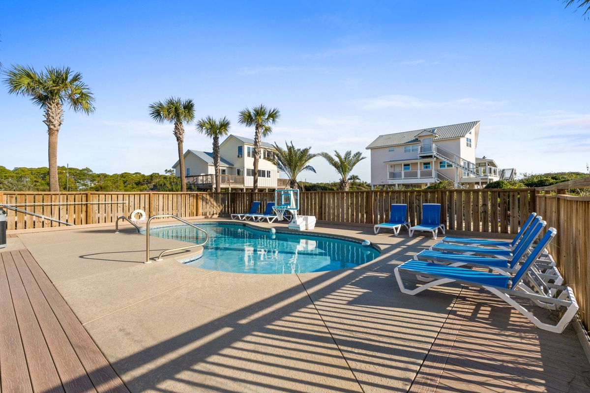 Your private pool oasis awaits, surrounded by swaying palms and comfortable loungers for perfect sunny days.