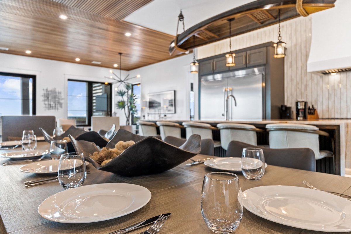 Gather around this elegant dining space where your group can share memorable meals together. Spacious seating, stunning woodwork, and a well-appointed kitchen create the perfect setting for your mountain retreat.