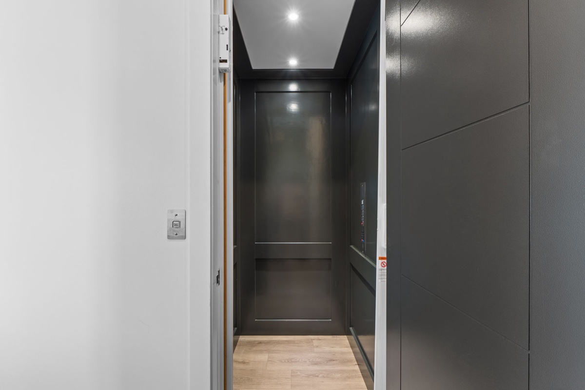 A private elevator provides seamless access to your retreat, combining sleek design with modern convenience for your comfort.