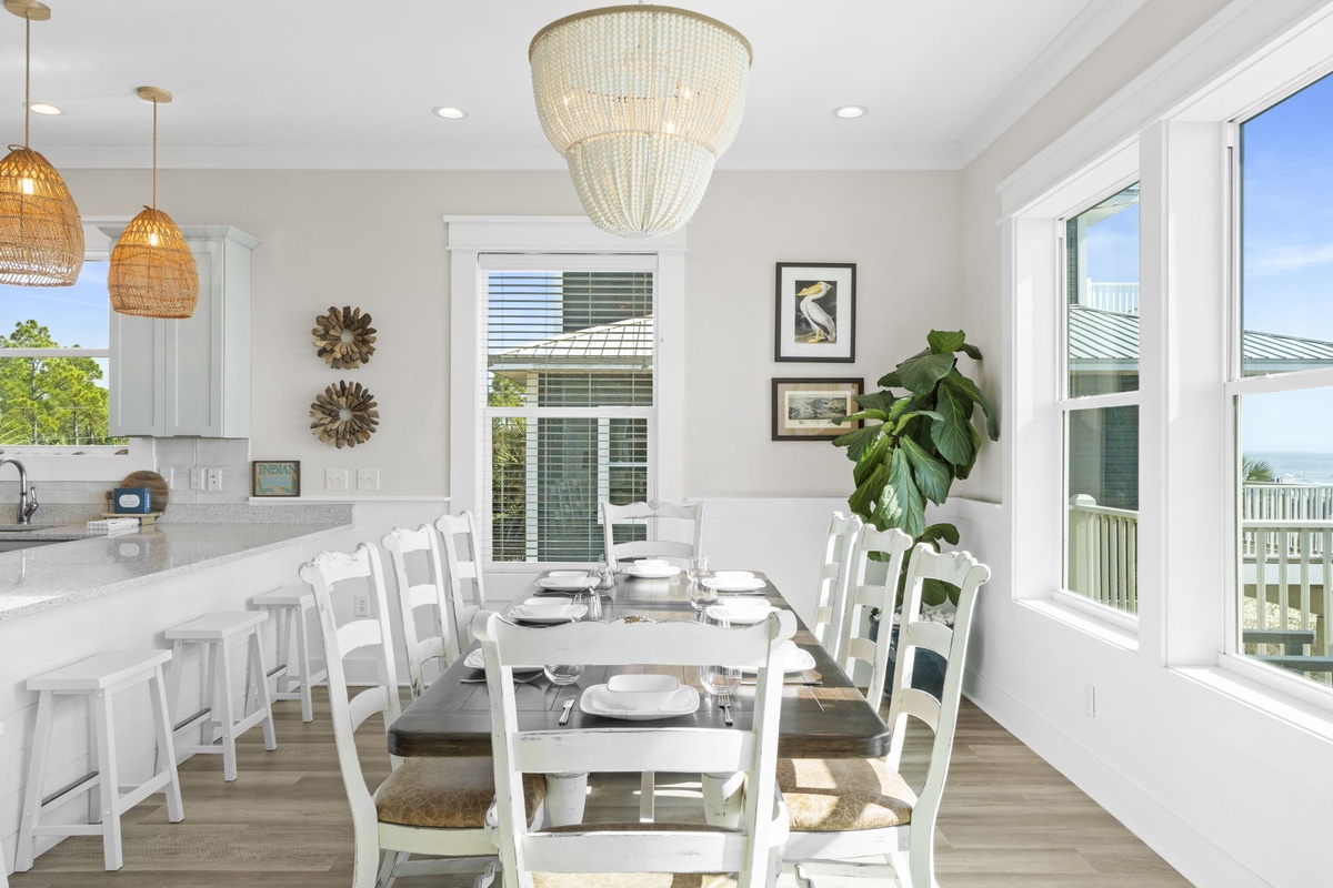 Gather around this bright dining space where coastal charm meets comfort, perfect for sharing meals with family and friends.