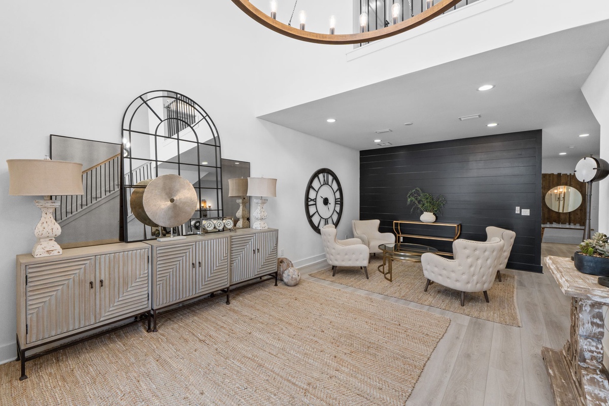 Sink into plush seating in your elegant living space, where soaring ceilings and designer touches create the perfect backdrop for relaxation.