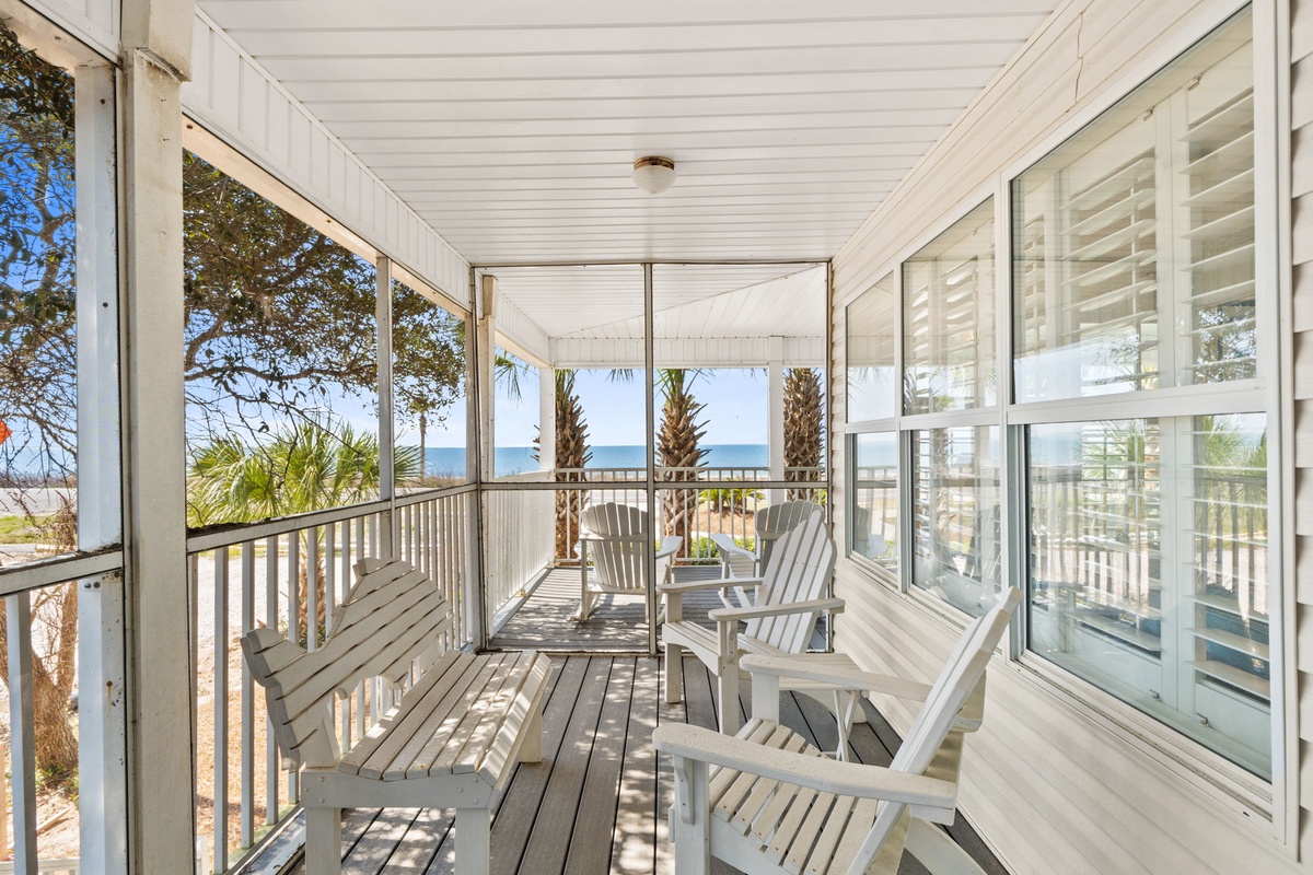Unwind on your private screened porch with Adirondack chairs, where ocean views and gentle breezes create the perfect coastal retreat.