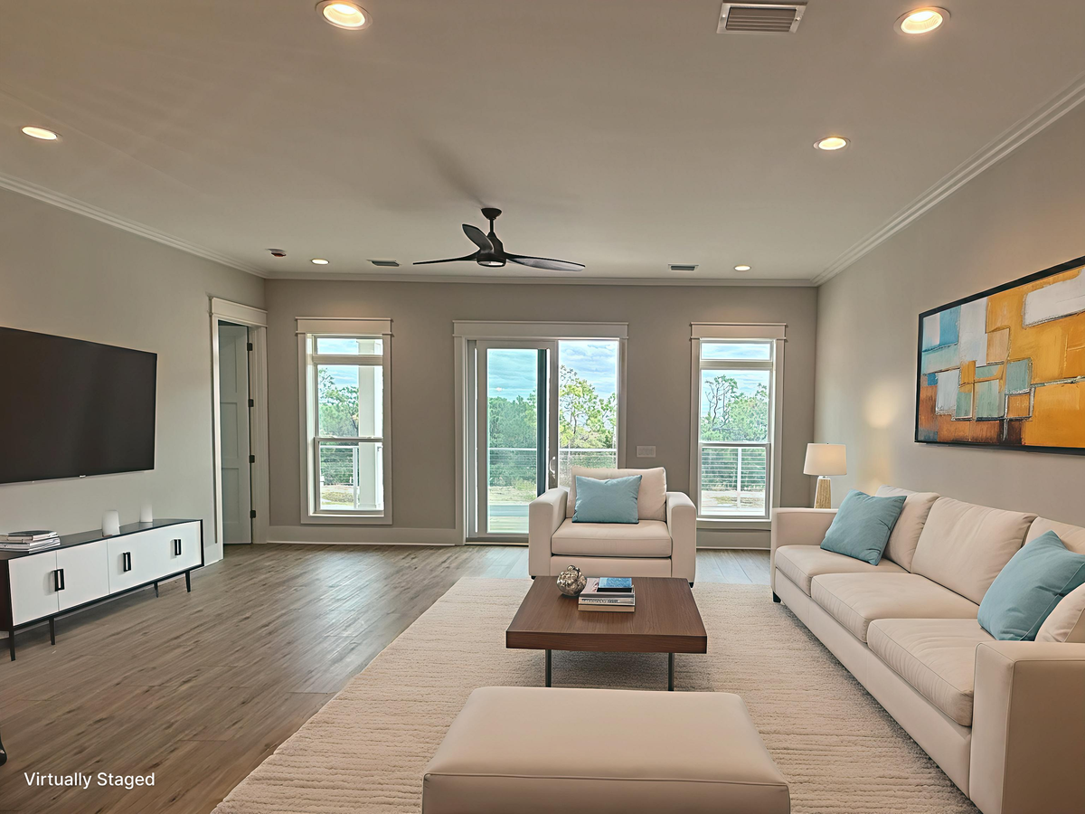 Relax in your modern living room with plush seating, natural light streaming through windows, and contemporary design touches throughout.