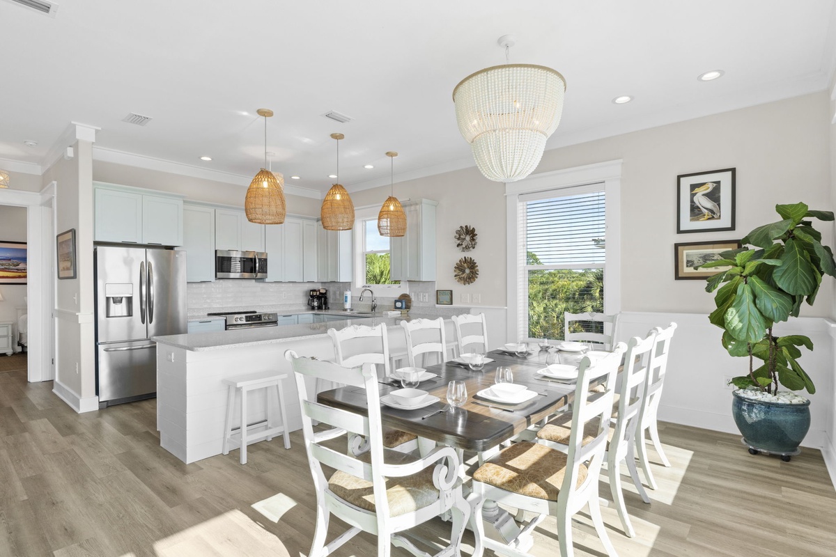 Your gourmet kitchen flows seamlessly into the dining area, where elegant lighting creates the perfect ambiance for memorable meals together.