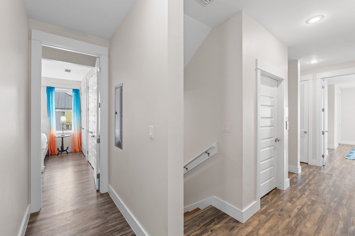 Step into your bright, spacious hallway where warm wood floors guide you through this thoughtfully designed home with easy access to every room.