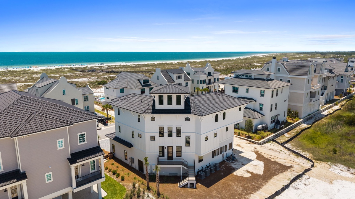 Beachfront property community located steps from pristine white sand shores and turquoise Gulf waters, offering convenient coastal access and stunning ocean proximity.