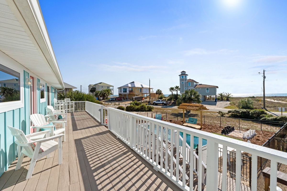 Enjoy elevated views of the surrounding neighborhood and a glimpse of the Gulf beyond.