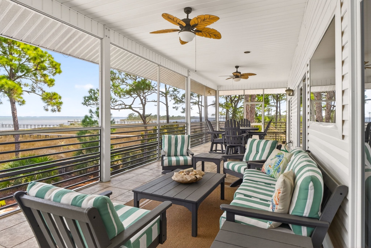 Settle into your private covered deck where coastal breezes and stunning water views create the perfect backdrop for morning coffee or evening relaxation.