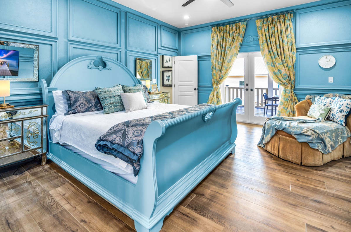 Unwind in your elegant turquoise bedroom, where luxurious linens and charming décor create a peaceful coastal retreat.