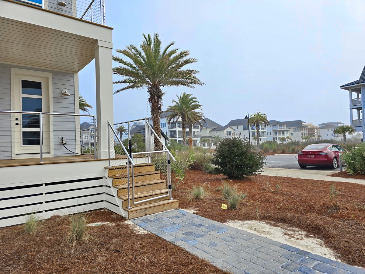 This property is located steps from the community Tesla chargers.