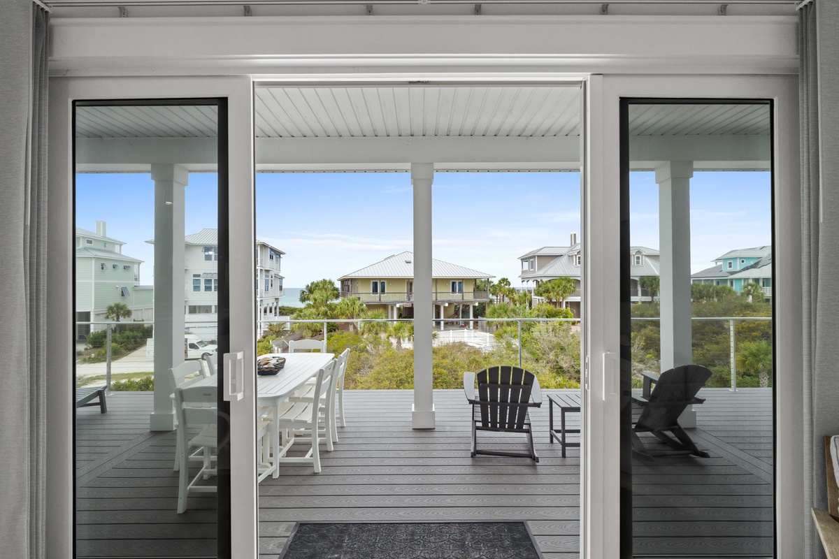 Your private balcony awaits with comfortable seating and peaceful neighborhood views, perfect for morning coffee or evening relaxation.
