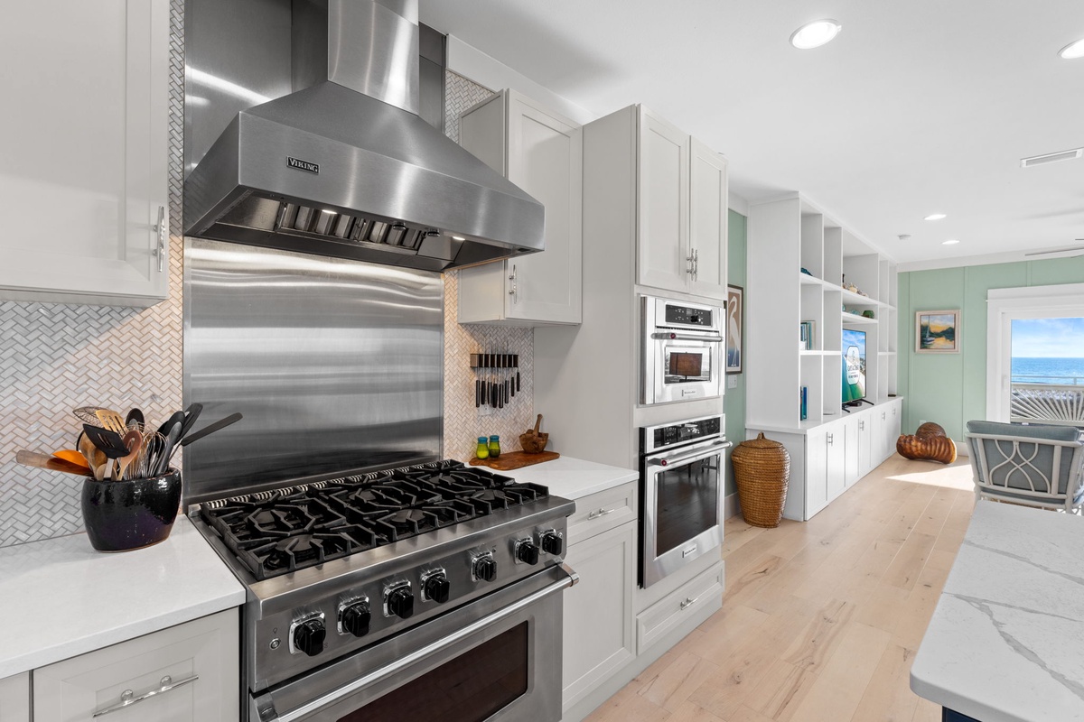 Your gourmet kitchen features professional-grade appliances and stunning ocean views for memorable meal preparation.