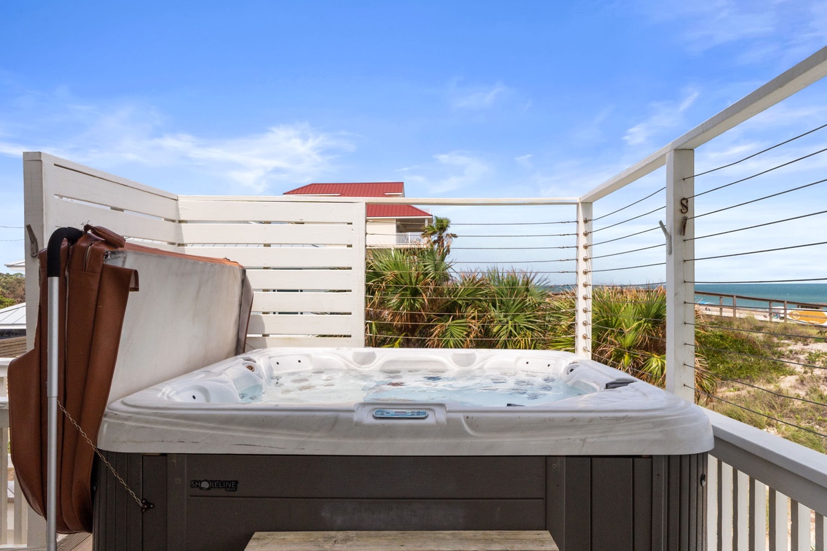 Soak away your cares in your private hot tub while gazing at coastal views and swaying palms just beyond the deck.