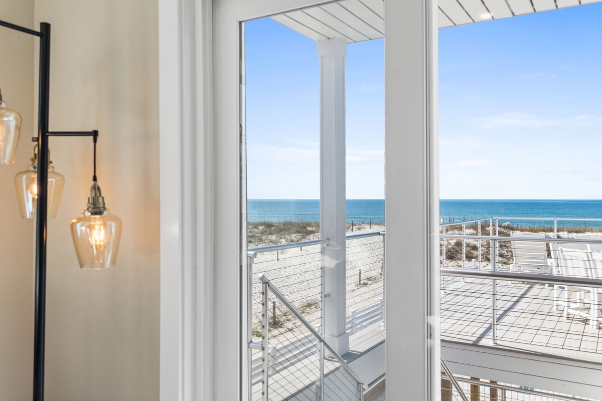 Wake up to stunning ocean views through your floor-to-ceiling windows, where the sea stretches endlessly beyond your private balcony.