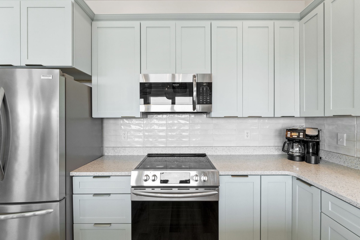 Your fully-equipped kitchen awaits with stainless steel appliances, ample counter space, and modern conveniences for cooking memorable meals.